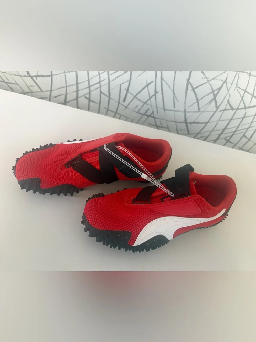 PUMA Mostro OG Sneakers. Vibrant  Red with a Unique Spike Sole.